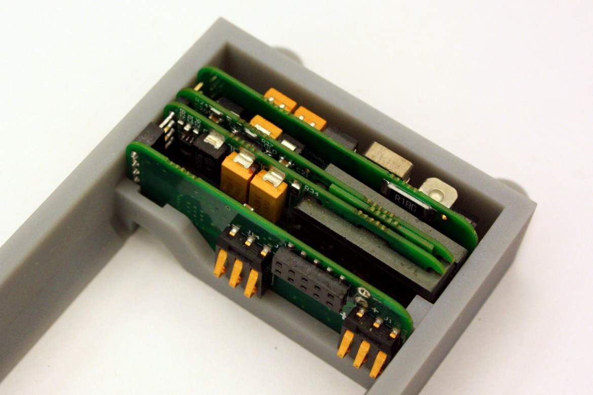 Intelligent solar battery charger inside battery holder